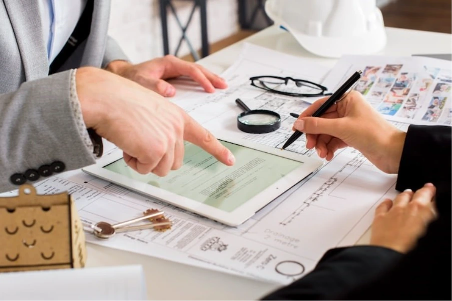 commercial mortgage lender reviewing property finance documents and loan application
