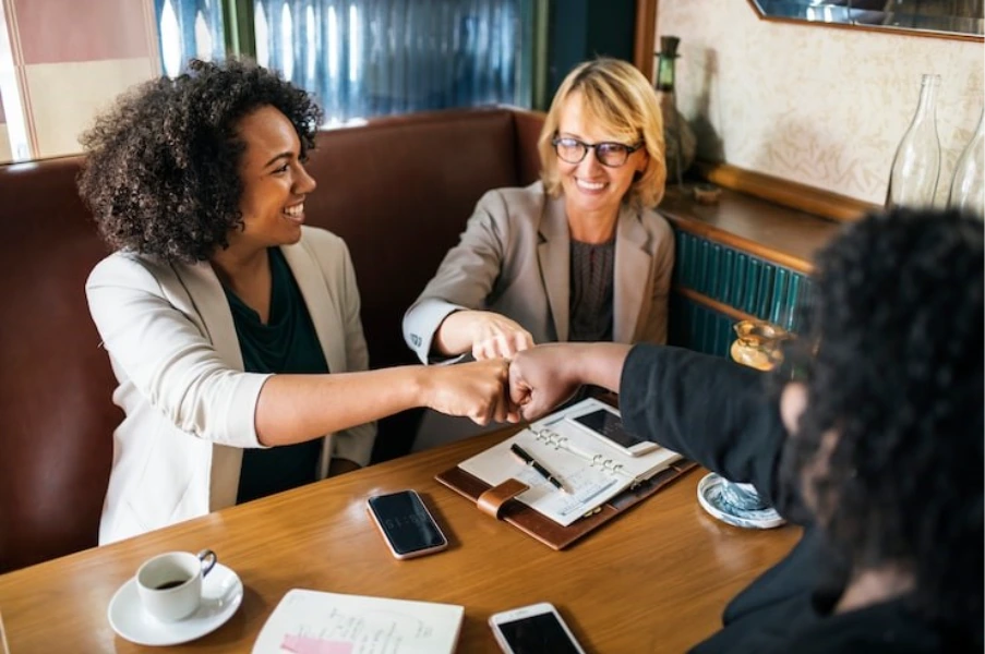 commercial mortgage broker discussing property finance with business clients